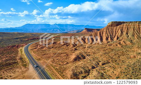 Aerial of Red Rock Formations and Winding Road in Utah Desert Aerial of Red Rock Formations and Winding Road in Utah Desert 122579093