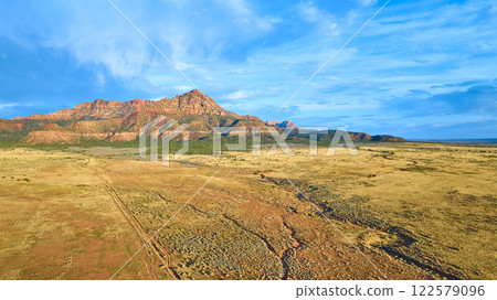Aerial of Gooseberry Mesa Desert and Mountains in Golden Hour Light 122579096