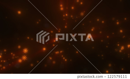 Radiant orange snowflakes glowing on a dark background, evoking warmth in a festive, winter-themed design 122579111
