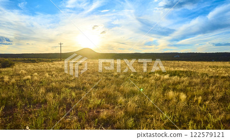 Aerial Sunset Over Gooseberry Mesa Utah with Rolling Hills and Utility Pole 122579121