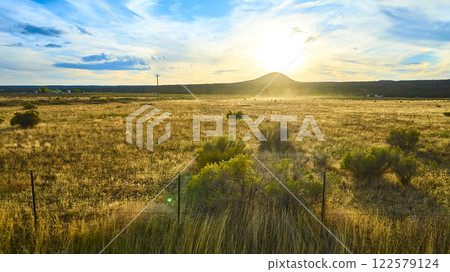 Aerial of Sunset Over Golden Field and Hill in Utah Aerial of Sunset Over Golden Field and Hill in Utah 122579124