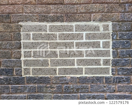 Urban Brick Wall Repair Detail with Eye-Level Perspective Urban Brick Wall Repair Detail with Eye-Level Perspective 122579176