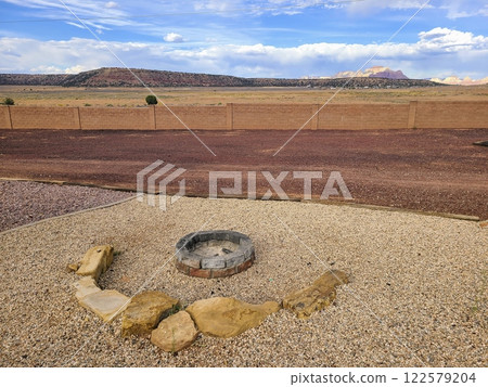 Desert Fire Pit and Mesas with Brick Wall in Utah Eye-Level View 122579204