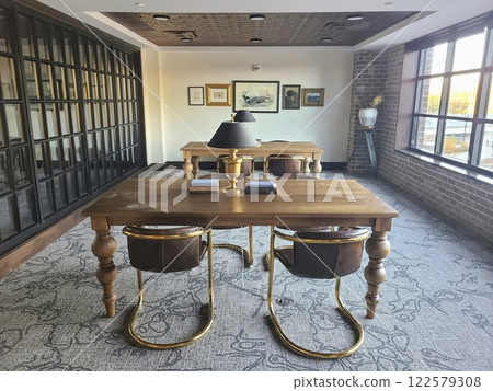 Elegant Office Interior with Leather Chairs and Natural Light Eye-Level View Elegant Office Interior with Leather Chairs and Natural Light Eye-Level View 122579308
