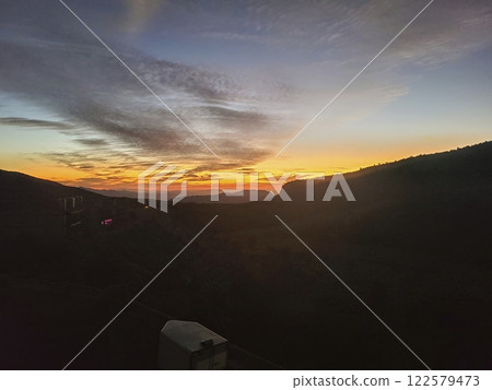 Sunset Over Zion Mountains Silhouette from Elevated Vantage Point Sunset Over Zion Mountains Silhouette from Elevated Vantage Point 122579473