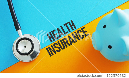A stethoscope and a piggy bank as a symbol of health insurance. 122579682
