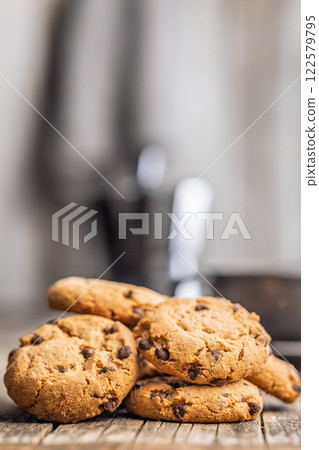Chocolate chip cookies on wooden table. 122579795
