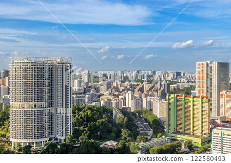 Modern developing residential district with tall skyscrapers and green park in the foreground, Singapore Modern developing residential district with tall skyscrapers and green park in the foreground, Singapore 122580493