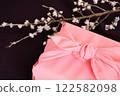 Pink furoshiki wrapping and cherry blossom branch 122582098