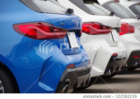 Imported car image: Imported cars lined up at a dealership: BMW rear Imported car image: Imported cars lined up at a dealership: BMW rear 122582219