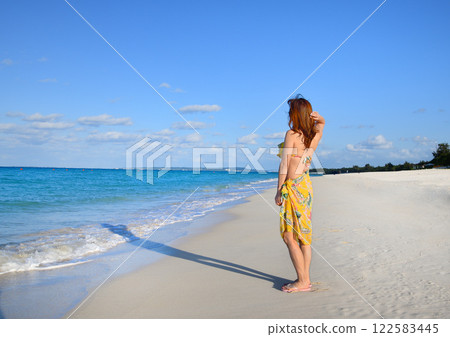 A woman enjoying the seaside A woman enjoying the seaside 122583445
