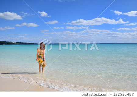 A woman enjoying the seaside 122583497