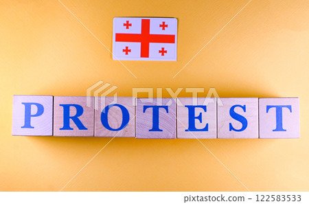 The inscription is made of wooden cubes. Protests are taking place in Georgia against the background of violations in the parliamentary elections. The inscription is made of wooden cubes. Protests are taking place in Georgia against the background of violations in the parliamentary elections. 122583533