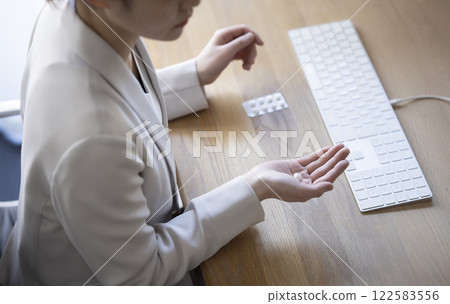 Business woman having stomach ache at work Business woman having stomach ache at work 122583556