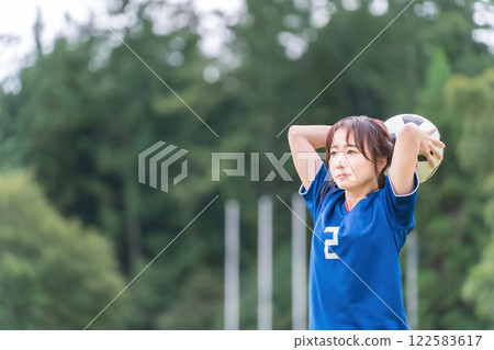 Futsal/female soccer player about to throw in Futsal/female soccer player about to throw in 122583617