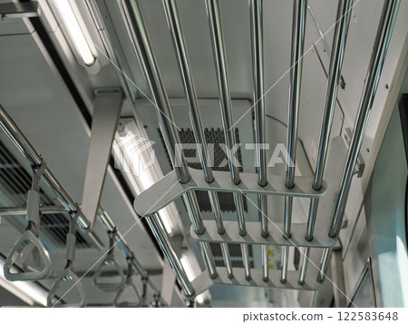 Metal pipe luggage racks on trains 122583648