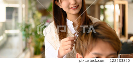 Woman working at a beauty salon Woman working at a beauty salon 122583830