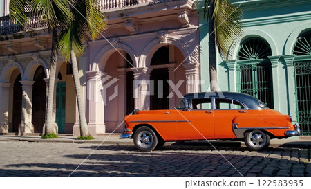Orange vintage car parked in Havana, Cuba 122583935