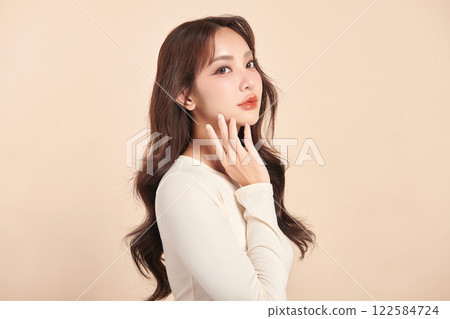 Beautiful young asian woman with clean fresh skin on beige background, Face care, Facial treatment, Cosmetology, beauty and spa, Asian women portrait. 122584724