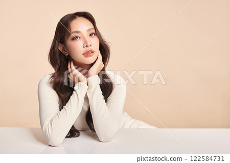 Beautiful young asian woman with clean fresh skin on beige background, Face care, Facial treatment, Cosmetology, beauty and spa, Asian women portrait. 122584731