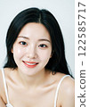 Natural Beauty Portrait of a Young Asian Woman with Glowing Skin 122585717