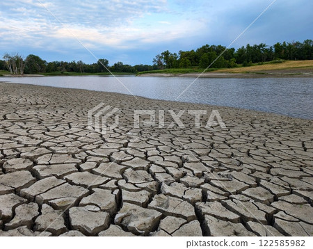 Dry river bank due to environmental issues  122585982