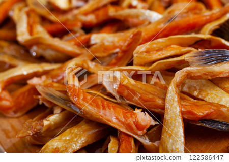 Image of slices of smoked salmon belly at plate Image of slices of smoked salmon belly at plate 122586447