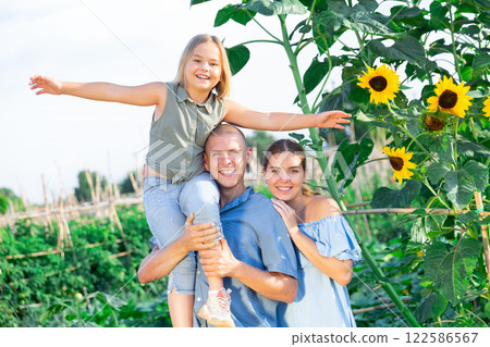 Family in kithcen garden Family in kithcen garden 122586567