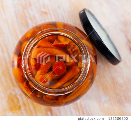 Pickled honey fungi in open jar 122586800