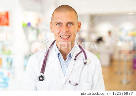 Portrait of male pharmacist in drugstore 122586987