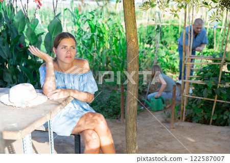 Unhappy woman wanted to travel to the beach but came to countrys 122587007