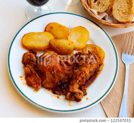 chicken with baked potatoes chicken with baked potatoes 122587033