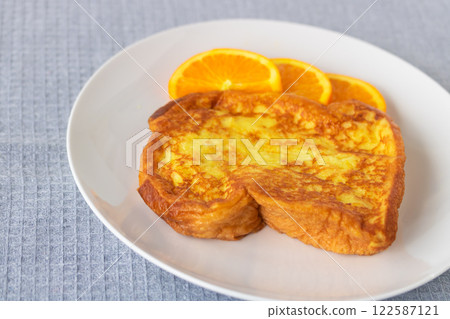 Fluffy and moist French toast with orange 122587121