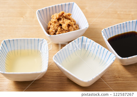 Fermented seasonings: miso, mirin, soy sauce, vinegar Fermented seasonings: miso, mirin, soy sauce, vinegar 122587267