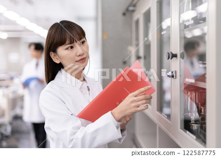Image of business in white coat Image of business in white coat 122587775