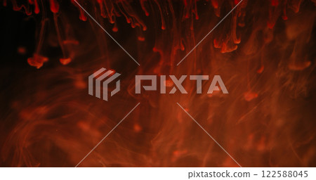 Blur fluid smoke. Liquid ink paint. Defocused red orange color shine drops flow vapor cloud texture waves on abstract art dark black background. 122588045