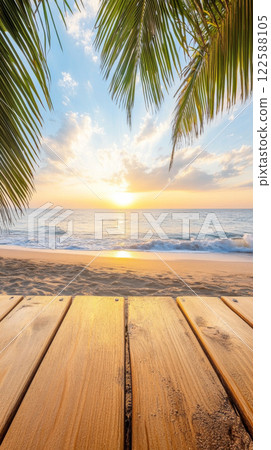 Golden sunset over tropical beach with palm leaves Golden sunset over tropical beach with palm leaves 122588105