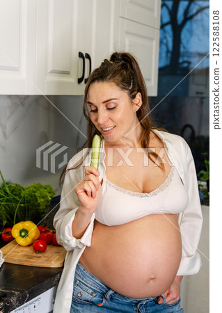 Pregnant Woman Healthy Cooking in Kitchen 122588108