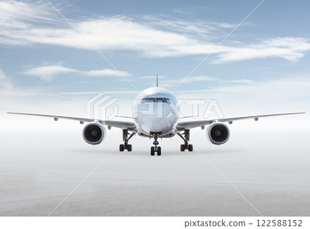Front view of wide body passenger plane isolated on bright background with sky 122588152