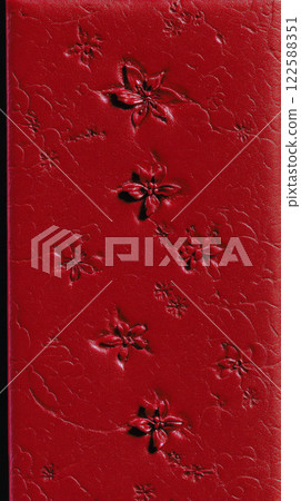 Red floral embossed pattern on leather Red floral embossed pattern on leather 122588351