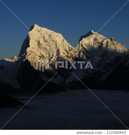 High mountains Cholatse and Taboche at sunset, Nepal. 122588943