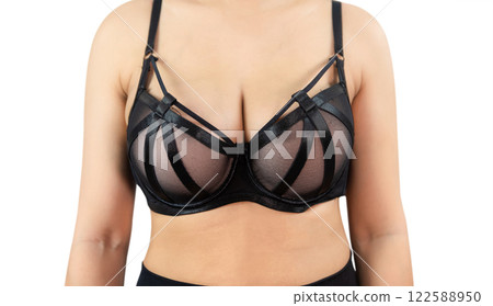 Woman with beautiful breasts, black bra isolated on white background, closeup. Woman with beautiful breasts, black bra isolated on white background, closeup. 122588950