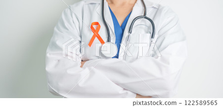 Doctor with Orange Ribbon for Leukemia, Kidney cancer day, world Multiple Sclerosis, CRPS, Self Injury Awareness month. Healthcare and word cancer day concept Doctor with Orange Ribbon for Leukemia, Kidney cancer day, world Multiple Sclerosis, CRPS, Self Injury Awareness month. Healthcare and word cancer day concept 122589565