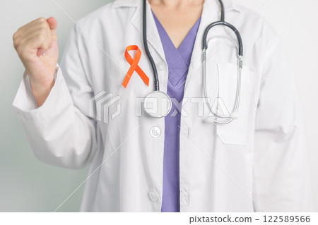Doctor with Orange Ribbon for Leukemia, Kidney cancer day, world Multiple Sclerosis, CRPS, Self Injury Awareness month. Healthcare and word cancer day concept Doctor with Orange Ribbon for Leukemia, Kidney cancer day, world Multiple Sclerosis, CRPS, Self Injury Awareness month. Healthcare and word cancer day concept 122589566