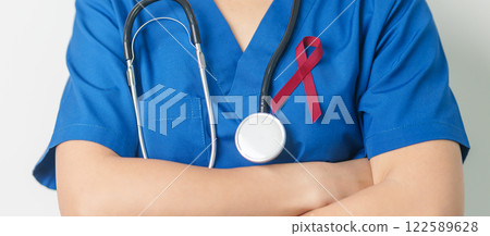Doctor with Burgundy Red Ribbon for March multiple myeloma Cancer and December World Aids Day Awareness month. Healthcare and world cancer day concept 122589628