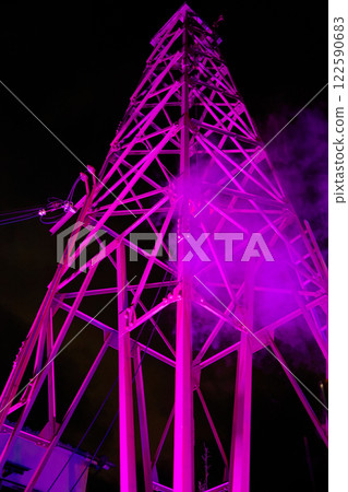 A steel tower lit up in the colors of passion A steel tower lit up in the colors of passion 122590683