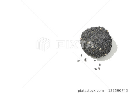 Black sesame balls photographed on a white background Black sesame balls photographed on a white background 122590743