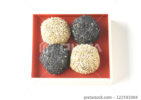 White and black sesame balls photographed on a white background 122591004