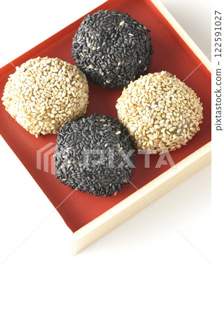 White and black sesame balls photographed on a white background 122591027