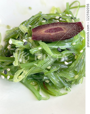 Chukka seaweed salad with sesame seeds on plate. Traditional Japanese food. Top view.  122592056